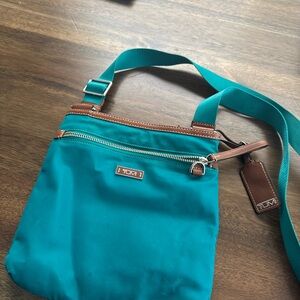 Tumi teal cross body bag